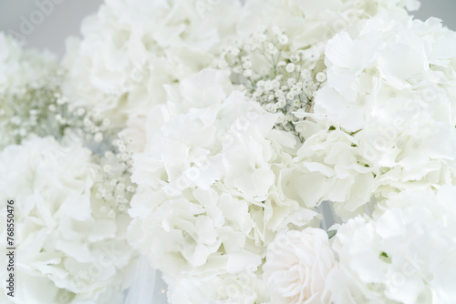 White rose and white hydrangea flowers, blossoming soft pastel floral background, wedding bouquet