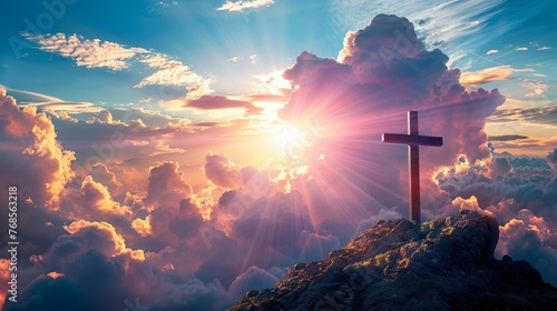 A spiritual Easter greeting card featuring the cross on Golgotha with rays of light piercing through clouds photo