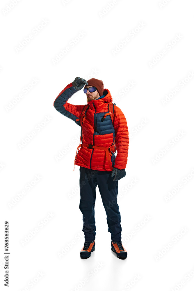 Outdoor apparel ad showcasing the warmth and versatility of climbing gear. Man in jacket with backpack isolated on white background. Concept of active lifestyle, tourism, mountaineering, sport, travel Outdoor apparel ad showcasing the warmth and versatility of climbing gear. Man in jacket with backpack isolated on white background. Concept of active lifestyle, tourism, mountaineering, sport, travel