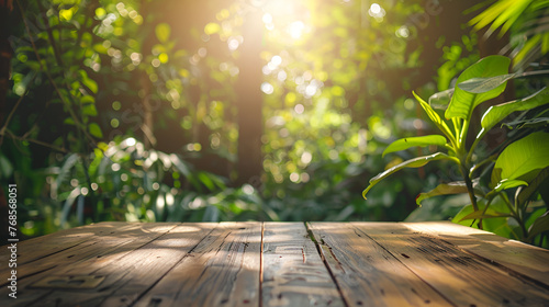 Empty wooden table for product display with blur background of tropical jungle 