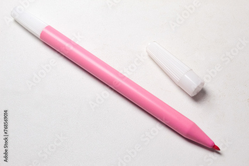 pink pen on a white background