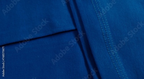 Blue fabric texture with seam. Abstract background and texture for design.