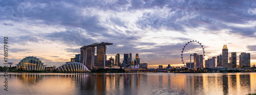 Wide panorama of CBD area in Singapore at dusk.