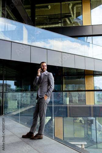 Confident Businessman Smili...