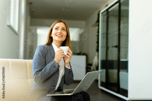 Elegant businesswoman enjoy...