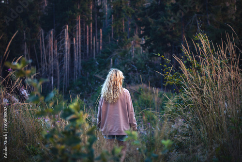 Young Blonde Girl Alone in Dark Forest