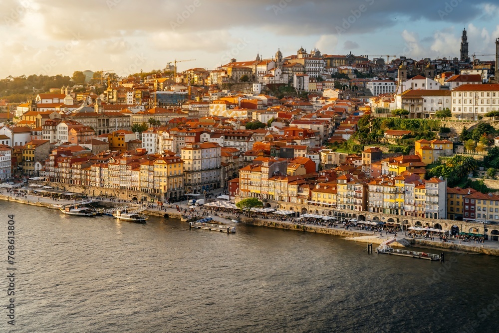 Old city of Porto, during sunset. Portugal's old town from the Dom Luis I bridge on the Douro river.
