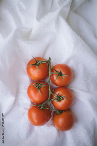 Tomatoes on a white material