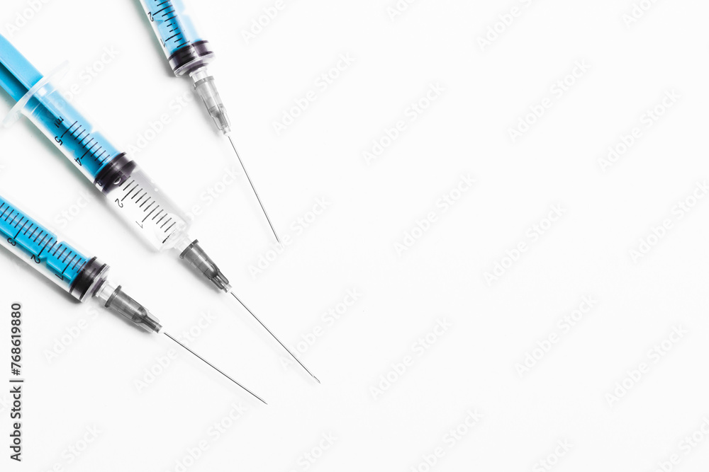 Disposable plastic syringe prepared for injection and vaccination in the hospital. The concept of medicine and health Disposable plastic syringe prepared for injection and vaccination in the hospital. The concept of medicine and health