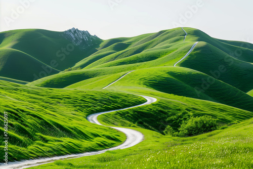White path winding through green hills under a clear sky, landscape photography photo