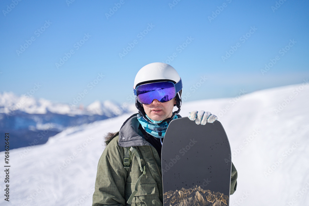 Snowboarder with a Mountain Backdrop Snowboarder with a Mountain Backdrop
