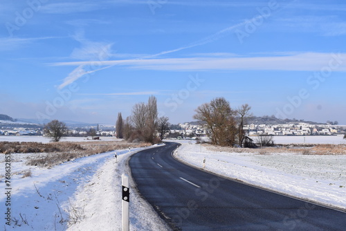 country road in snow covered land