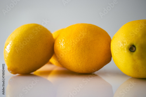 Fresh Organic Lemons Just Out of Freezer on White Background