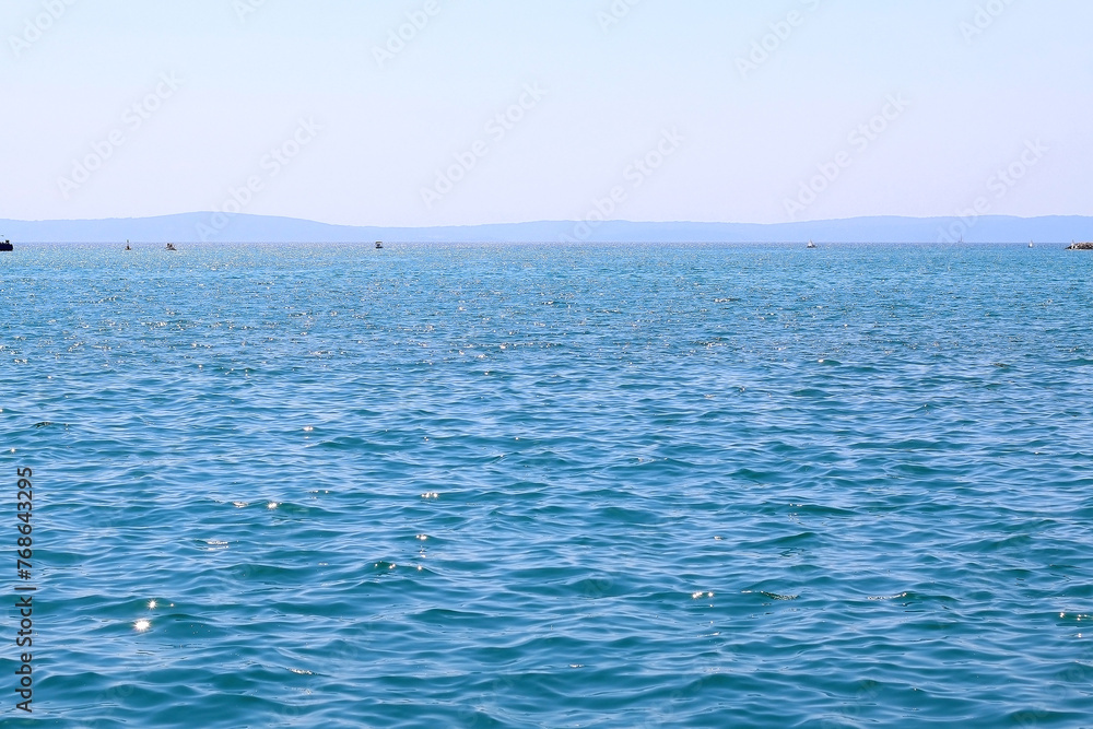 Fototapeta premium Bright blue sea and clear sky. Copy space.