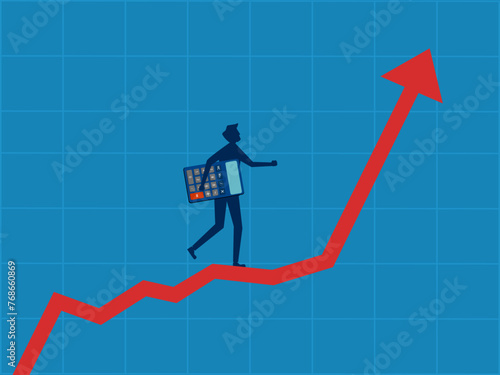 Financial plan. Businessman holding a calculator walks up on a growing graph