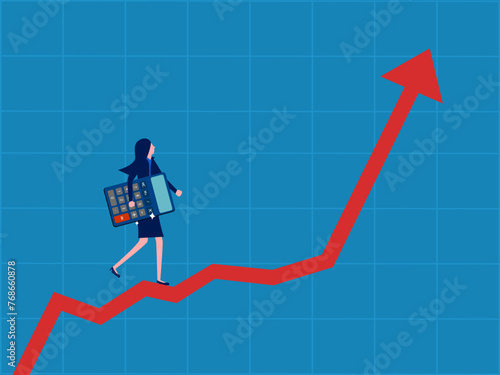 Strategy for making profits. Businesswoman holding a calculator walks up on a growing graph
