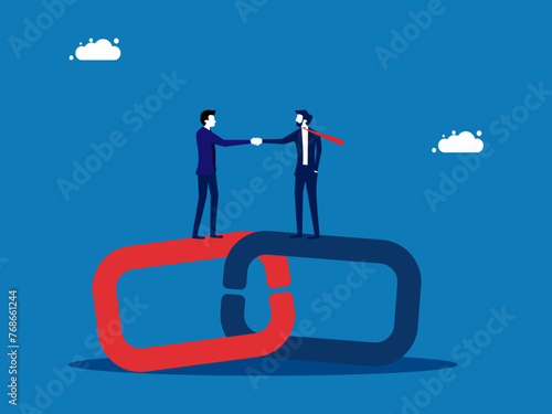 Business cooperation. Businessman holding hands on connecting chains