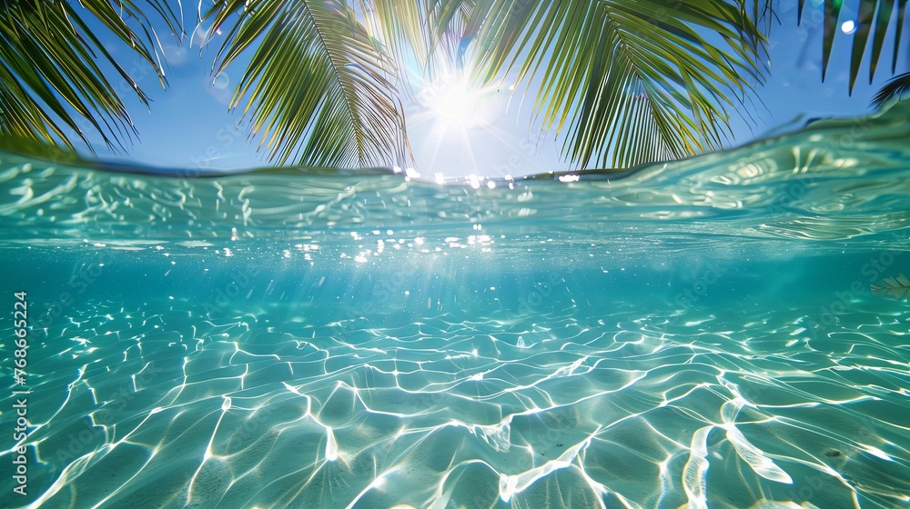 summer background with clear blue water, sun and palm trees on an exotic beach - obrazy, fototapety, plakaty 