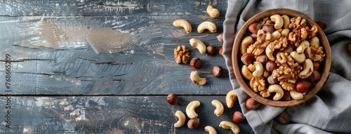 a wooden bowl filled with a colorful assortment of mixed nuts, providing ample copy space for text, perfect for promoting healthy snacking.