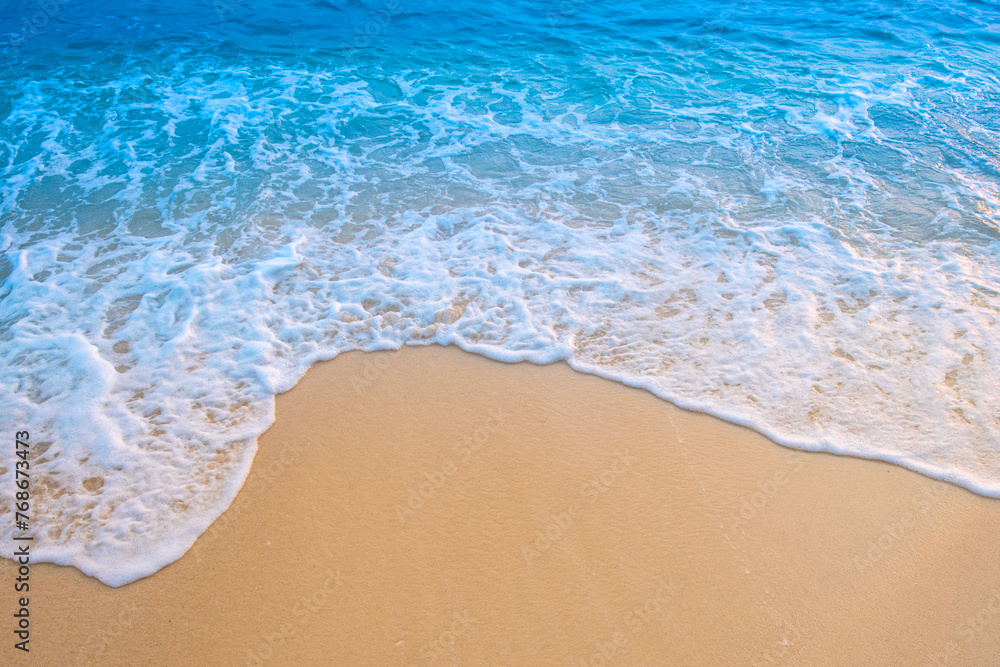 Top view of sandy beach for summer vacation concept. Nature of the beach and sea in summer with sunlight, and light sand. The sea sparkles against the blue sky. Sandy Beach for summer vacationconcept. Top view of sandy beach for summer vacation concept. Nature of the beach and sea in summer with sunlight, and light sand. The sea sparkles against the blue sky. Sandy Beach for summer vacationconcept.