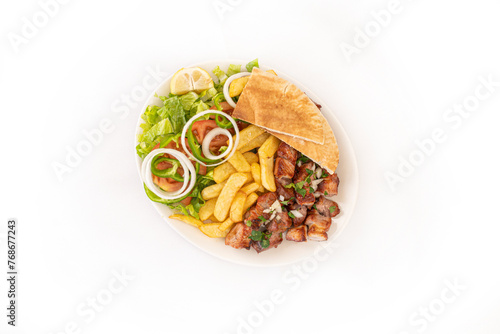 Greek Cypriot Pork Souvlaki - Pork Chopped into bite-sized chunks with salad and chips