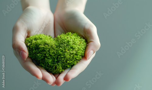 hands holding green heart shaped tree love nature save the world heal the world environmental preservation