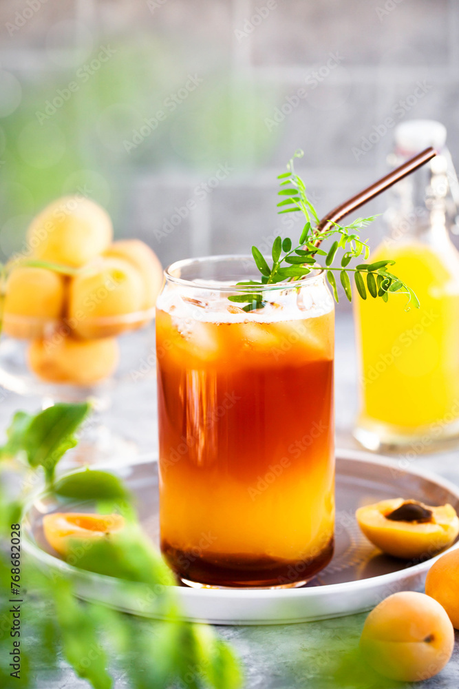 Fototapeta premium Bumble coffee - refreshment summer iced cocktail with espresso, orange juice, caramel syrup and ice