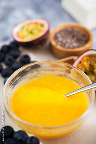 Chia pudding with  yogurt, mango and passion fruit, making process