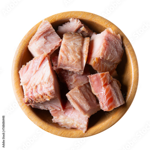 Fish pieces in wooden bowl isolated on white background.  Hot smoked african catfish (Clarias gariepinus). Top view.