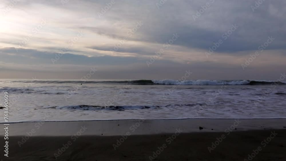 Slow motion shot of the Pacific ocean waves on the shoreline of southern California at sunset, USA Slow motion shot of the Pacific ocean waves on the shoreline of southern California at sunset, USA