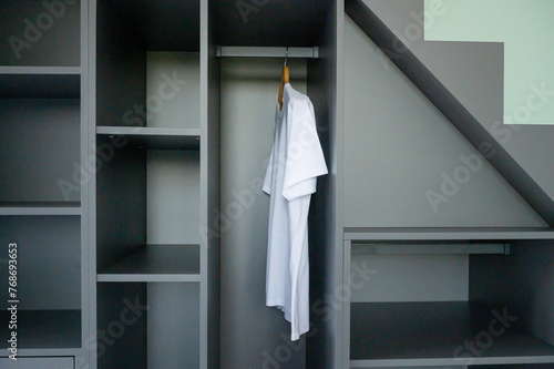 Minimalist White Bathrobe in Modern Closet