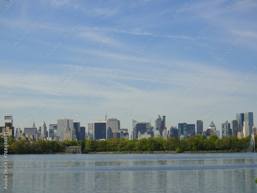 Central Park reservoir Upper West Side skyline blue sky Manhattan New York City USA