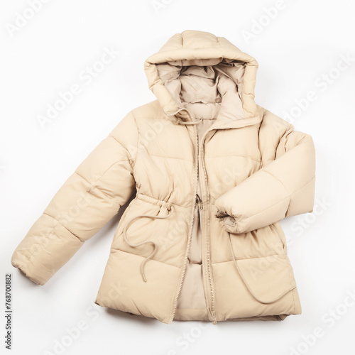Warm jacket on a white background. Women's stylish autumn or winter clothes. Cozy winter look. Flat lay, top view.