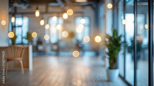 An empty office space with a blurred background. The office is filled with abstract light bokeh, which can be used as a design element. © Farda