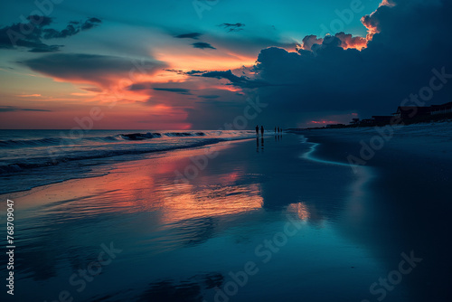 Silhouettes of a couple enjoying a romantic walk on the beach under the stunning colors of the sunset sky.