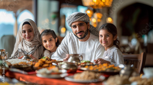 Family sharing a joyful Iftar meal during Ramadan with traditional dishes