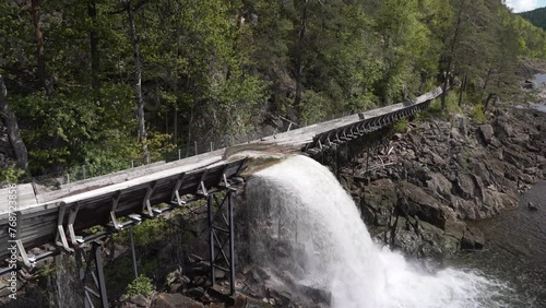 log flume of the historic restored wooden raft channel or timber slide of Tommerrenna in southern Norway near Vennesla is popular destination for hikers photo