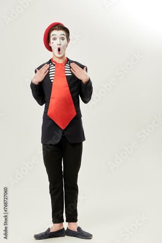 clown mime with red tie