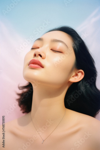Portrait of beautiful asian woman with perfect skin and closed eyes