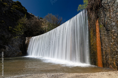 View of the artificial waterfall of Hot Waters or Zesta Nera near the city of Sidirokastro in Macedonia, Greece