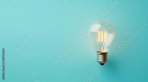 Light bulb on blue background. Concept of idea, innovation and creativity.