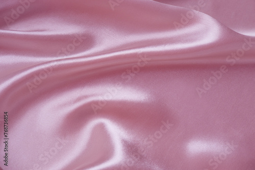 elegant delicate silk texture in pink pastel color with soft, gentle folds, interior design concept, silk cloth background, copy space for designer, mockup