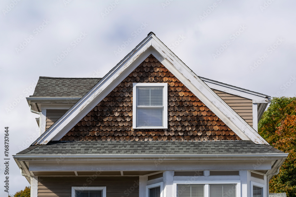 Shingled gable end of a family house in Brighton, MA, USA Shingled gable end of a family house in Brighton, MA, USA