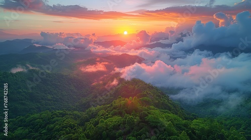 Sun Setting Over Clouds in Mountains