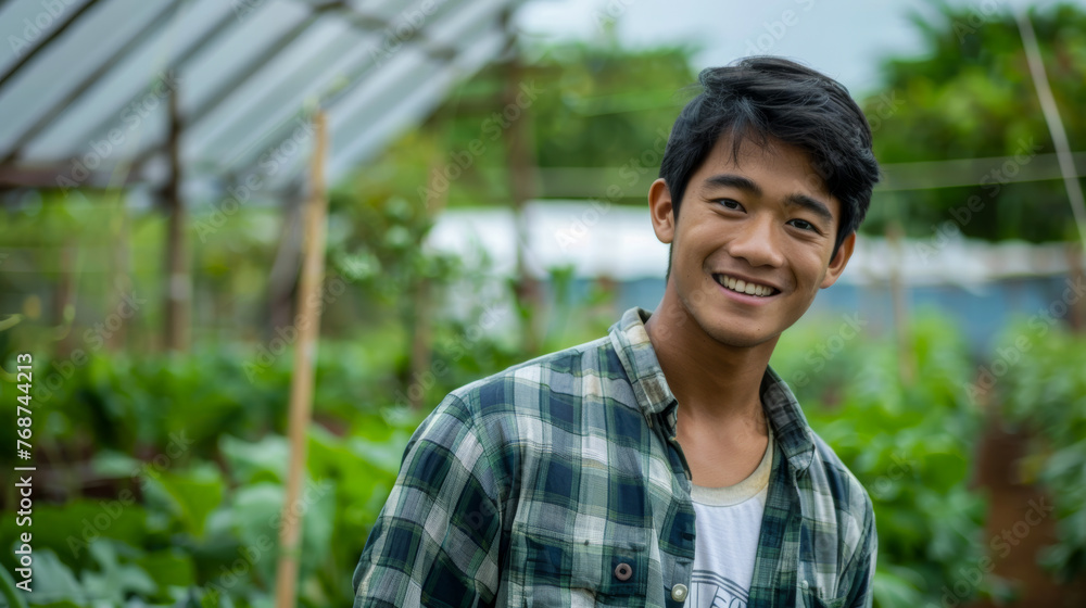 A detailed capture of a man with his face obscured, set amidst the lush greens of a greenhouse A detailed capture of a man with his face obscured, set amidst the lush greens of a greenhouse
