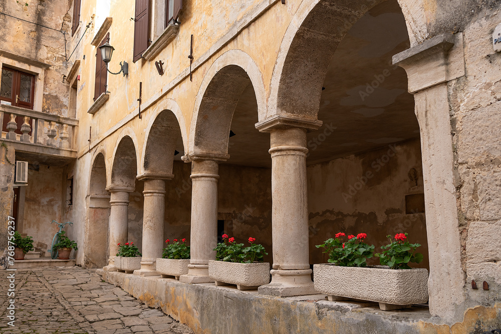 Beautiful courtyard with arches and flower pots