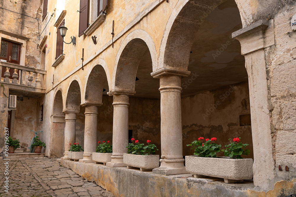 Beautiful courtyard with arches and flower pots Beautiful courtyard with arches and flower pots