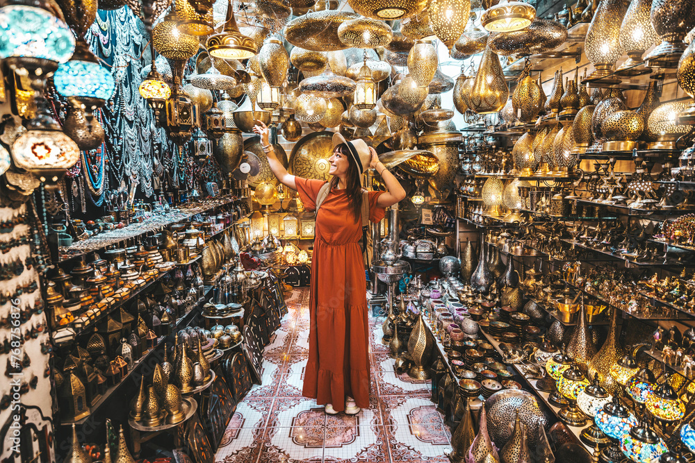 Ταπετσαρία Young traveling woman visiting a copper souvenir handicraft shop in Marrakesh, M