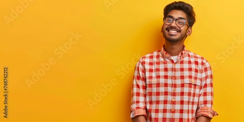 Happy Young Man in Glasses and Plaid Shirt photo