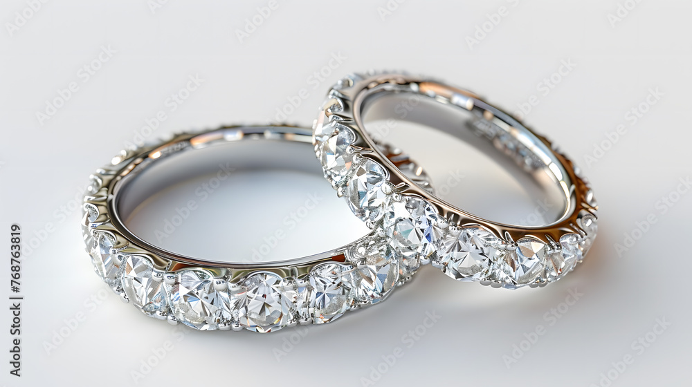 A Pair of Diamond Platinum Rings on White Background A Pair of Diamond Platinum Rings on White Background